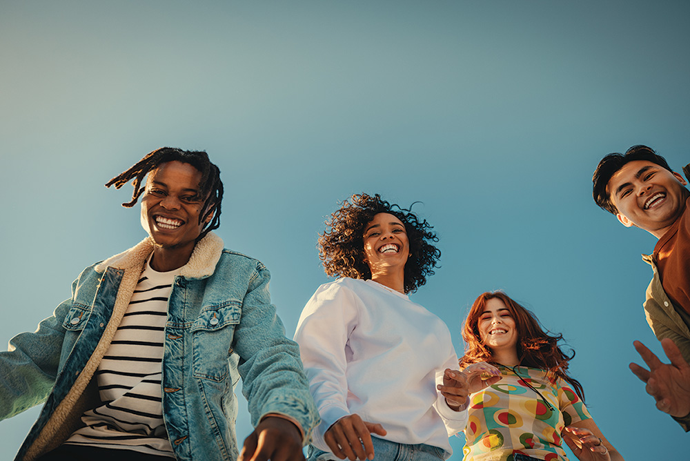 Group of happy young friends having fun outdoors